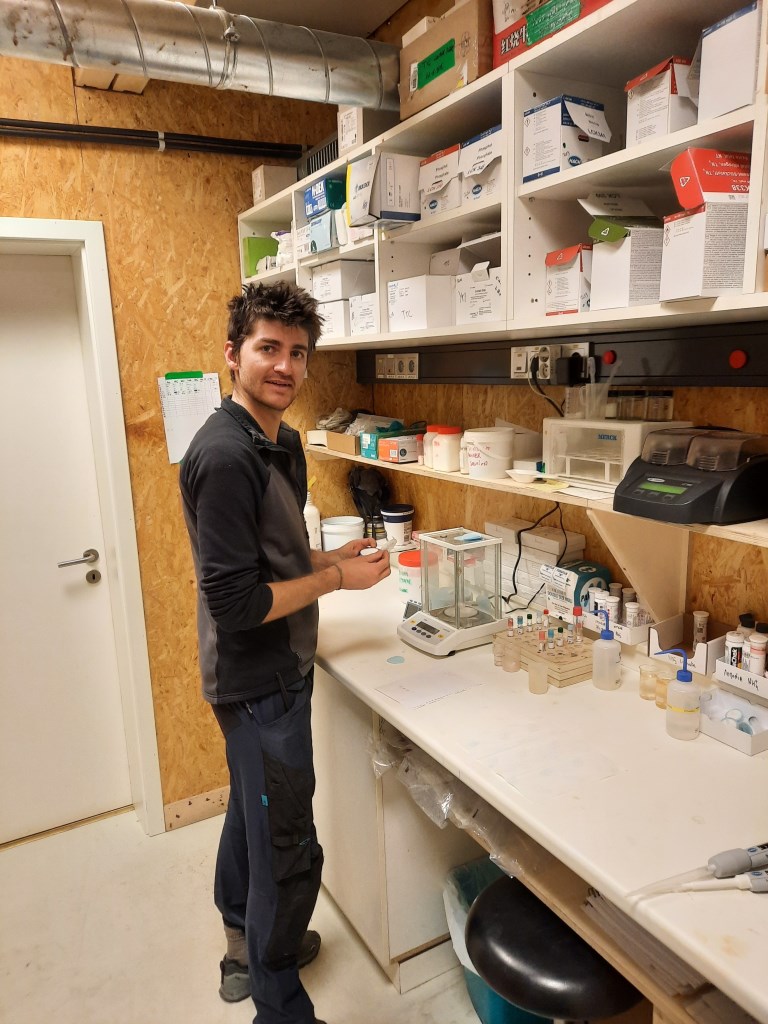 Fig. 6-3: Timothée busy with the manual tests performed on a daily basis in the station laboratory